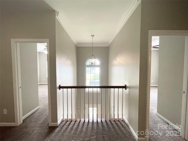 2834 Ritz Ln, Matthews, NC 28105 - hallway featuring carpet, ornamental molding, an upstairs landing, and a chandelier