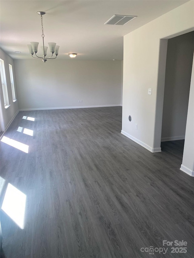 440 Phifer Rd, Kings Mountain, NC 28086 - empty room featuring a chandelier and dark wood-style flooring