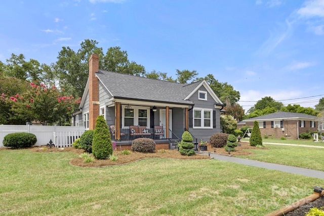 305 E Marion St, Kershaw, SC 29067 - bungalow featuring a porch, ceiling fan, and a chimney
