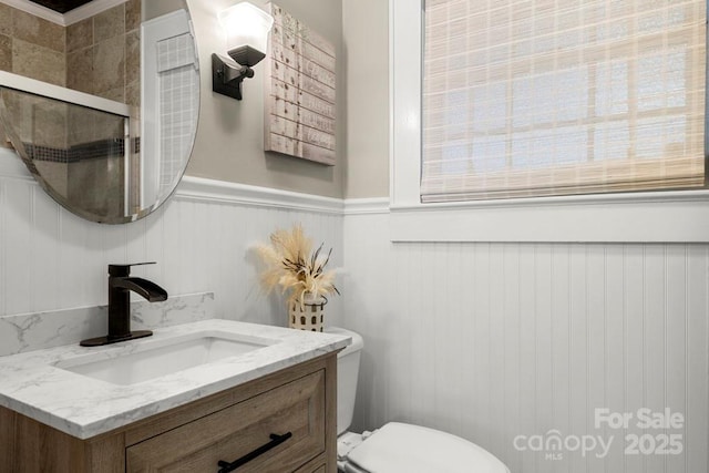 305 E Marion St, Kershaw, SC 29067 - bathroom with vanity, a wainscoted wall, and a shower with door