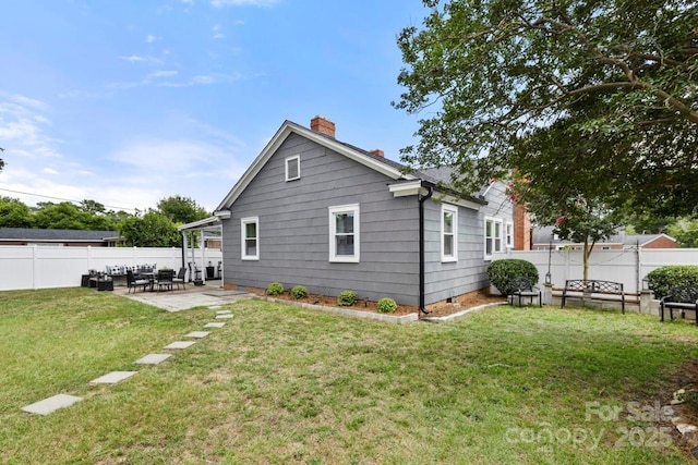 305 E Marion St, Kershaw, SC 29067 - back of house featuring a chimney, a fenced backyard, a patio area, and crawl space