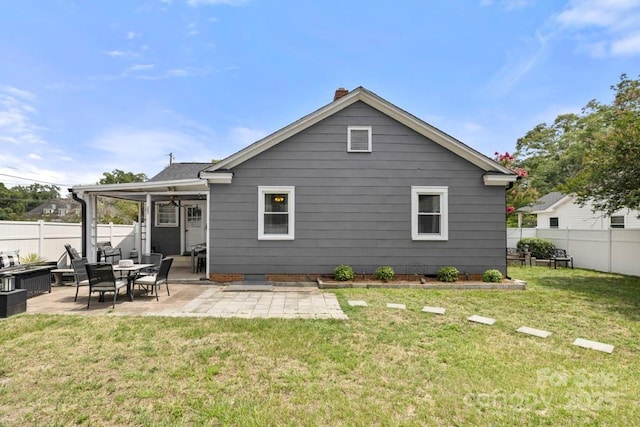 305 E Marion St, Kershaw, SC 29067 - rear view of property featuring a fenced backyard, a patio area, and a chimney