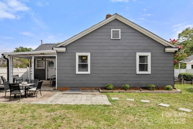 305 E Marion St, Kershaw, SC 29067 - rear view of house with a patio and a chimney