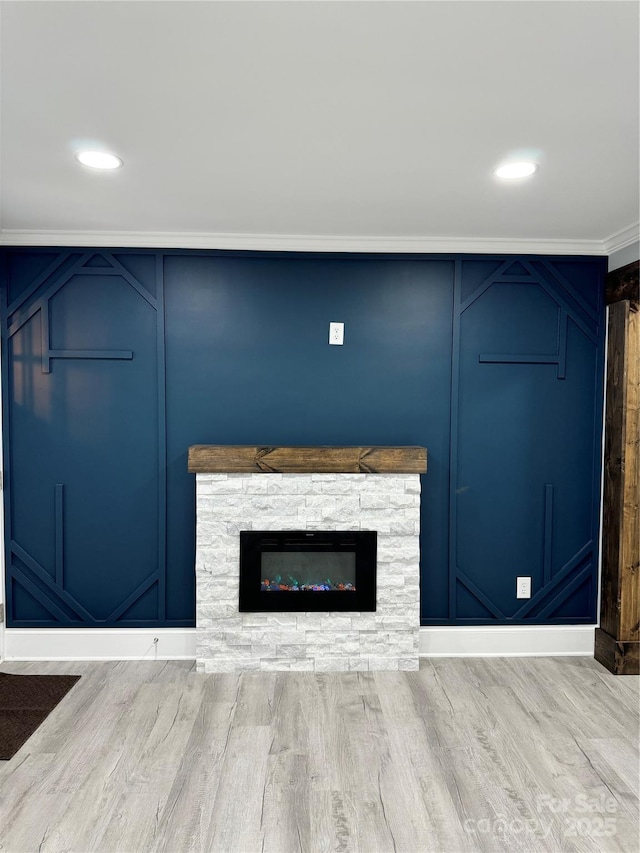911 S Spencer Ave, Spencer, NC 28915 - detailed view of wood finished floors, a stone fireplace, recessed lighting, and a decorative wall