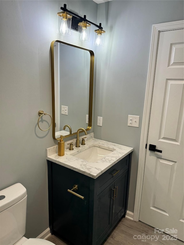 911 S Spencer Ave, Spencer, NC 28915 - bathroom featuring vanity and wood finished floors