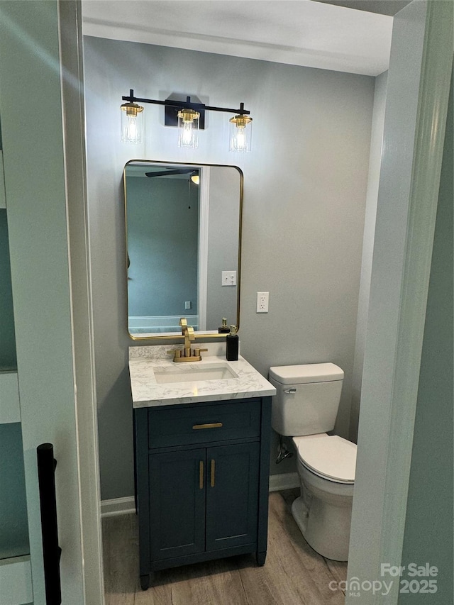 911 S Spencer Ave, Spencer, NC 28915 - bathroom featuring wood finished floors and vanity