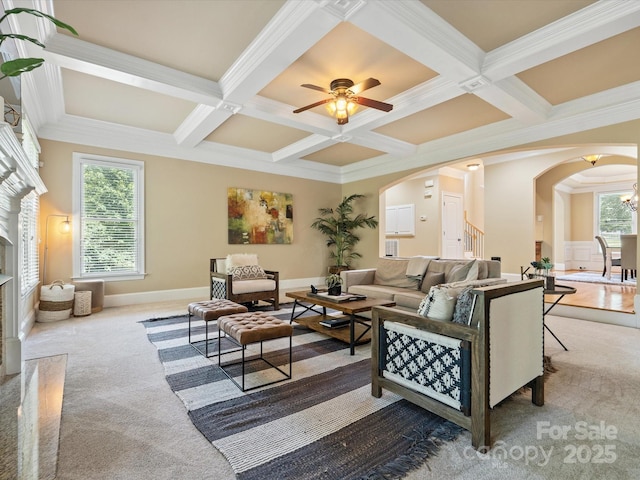 8407 Rolling Fields Rd, Mint Hill, NC 28227 - carpeted living area featuring arched walkways, coffered ceiling, beam ceiling, ornamental molding, and a fireplace