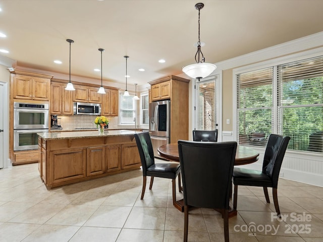 8407 Rolling Fields Rd, Mint Hill, NC 28227 - dining space with ornamental molding, wainscoting, light tile patterned floors, and recessed lighting