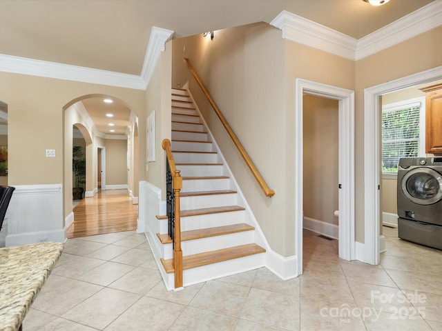 8407 Rolling Fields Rd, Mint Hill, NC 28227 - stairs with washer / clothes dryer, crown molding, tile patterned floors, and arched walkways
