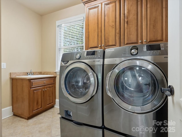 8407 Rolling Fields Rd, Mint Hill, NC 28227 - laundry room featuring independent washer and dryer, cabinet space, and light tile patterned floors