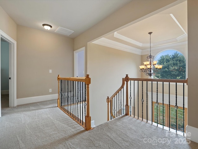 8407 Rolling Fields Rd, Mint Hill, NC 28227 - staircase with a chandelier, carpet floors, crown molding, and a tray ceiling