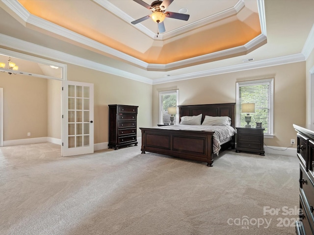 8407 Rolling Fields Rd, Mint Hill, NC 28227 - bedroom with a raised ceiling, ornamental molding, light carpet, french doors, and ceiling fan