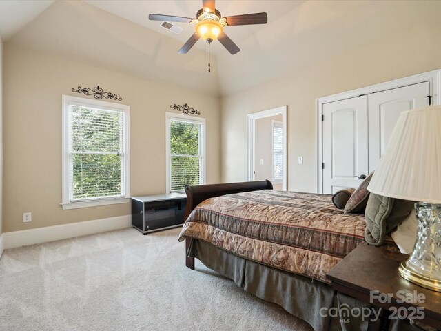 8407 Rolling Fields Rd, Mint Hill, NC 28227 - bedroom with carpet, vaulted ceiling, a ceiling fan, and a closet