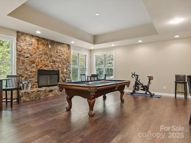 8407 Rolling Fields Rd, Mint Hill, NC 28227 - rec room featuring a tray ceiling, wood finished floors, recessed lighting, a stone fireplace, and billiards