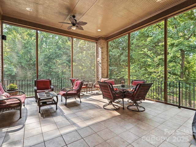 8407 Rolling Fields Rd, Mint Hill, NC 28227 - sunroom / solarium featuring ceiling fan, a forest view, and plenty of natural light
