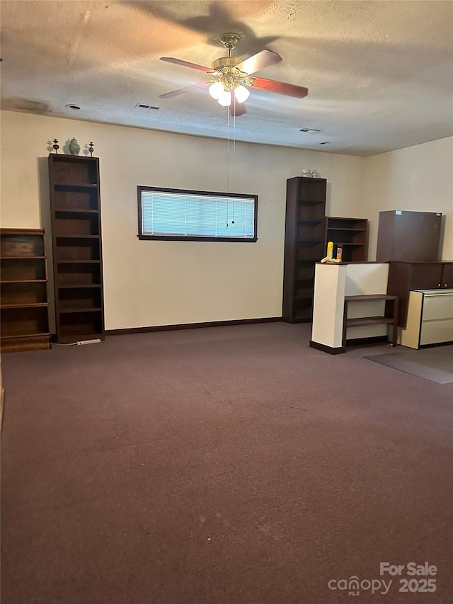 2128 Senior Dr, Charlotte, NC 28216 - unfurnished living room with carpet, ceiling fan, and a textured ceiling