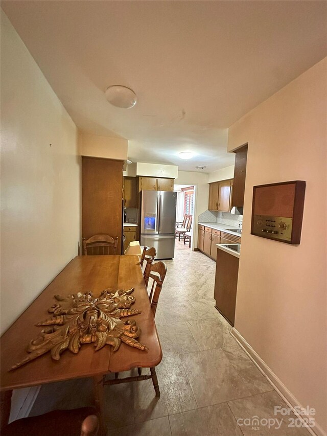 2128 Senior Dr, Charlotte, NC 28216 - dining space featuring baseboards