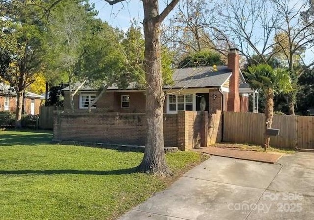 1162 Brighton Pl, Charlotte, NC 28205 - view of front facade with a chimney and brick siding
