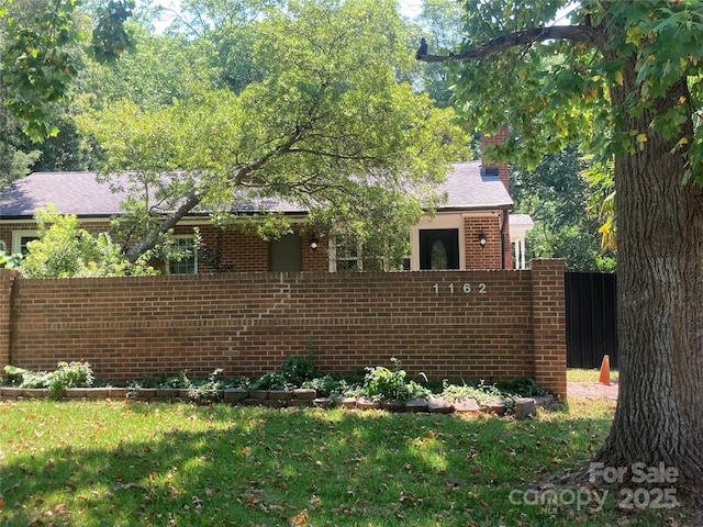 1162 Brighton Pl, Charlotte, NC 28205 - view of front facade with brick siding and a chimney