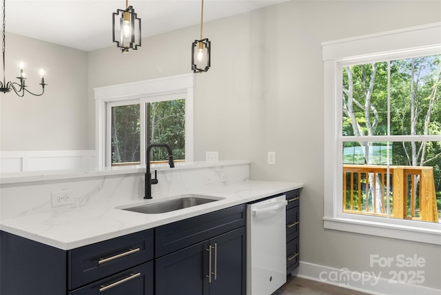 299 Collingswood Dr, Concord, NC 28027 - kitchen with dishwasher, plenty of natural light, light stone countertops, and decorative light fixtures