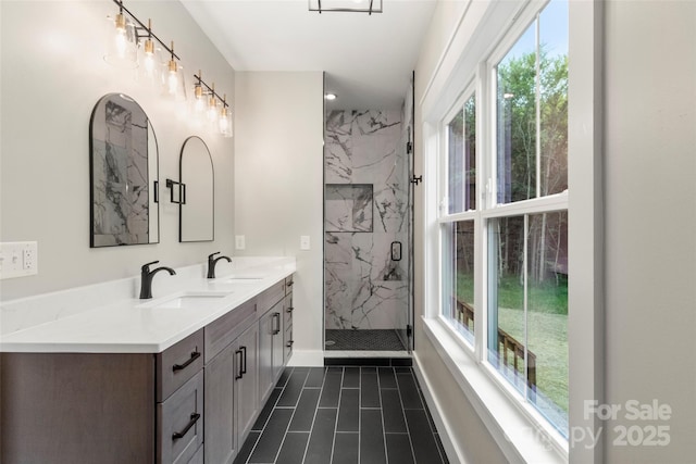 299 Collingswood Dr, Concord, NC 28027 - bathroom with healthy amount of natural light, double vanity, and a marble finish shower