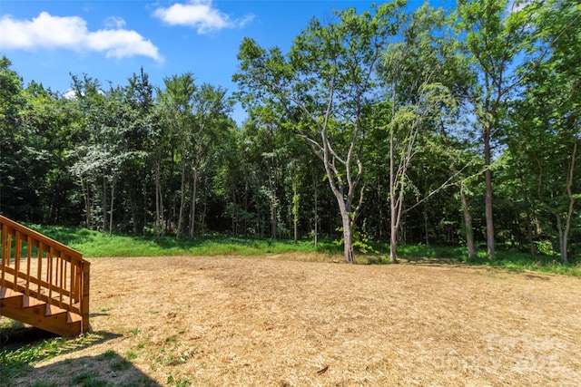 299 Collingswood Dr, Concord, NC 28027 - view of yard with a view of trees and stairway