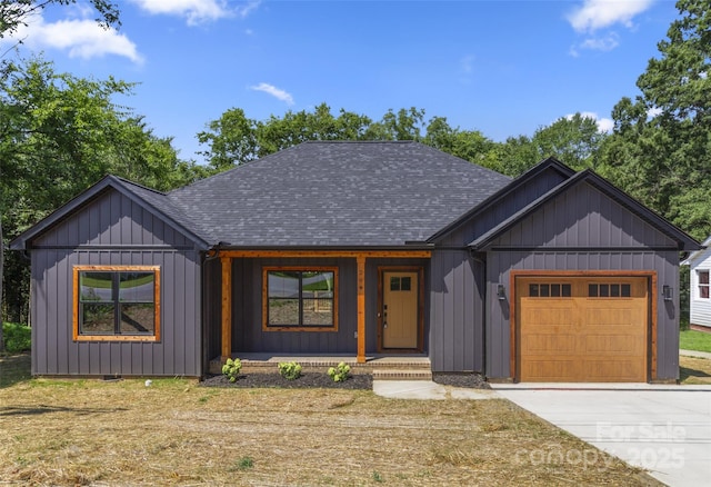 299 Collingswood Dr, Concord, NC 28027 - modern farmhouse style home featuring roof with shingles, a garage, a porch, concrete driveway, and board and batten siding