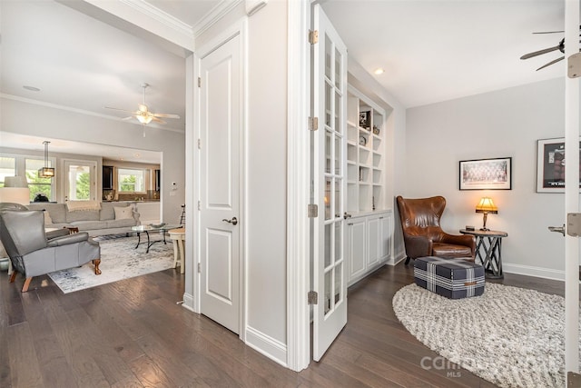7025 Overjoyed Xing, Charlotte, NC 28215 - sitting room featuring ceiling fan, dark wood-style floors, ornamental molding, and recessed lighting