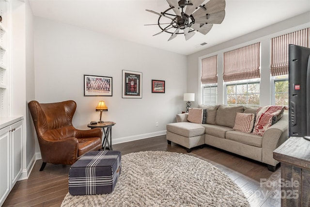 7025 Overjoyed Xing, Charlotte, NC 28215 - living area featuring dark wood finished floors and ceiling fan