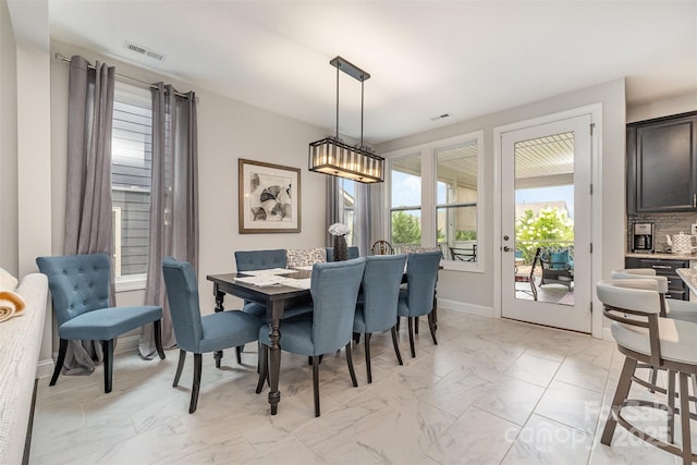7025 Overjoyed Xing, Charlotte, NC 28215 - dining area with light marble finish flooring and baseboards