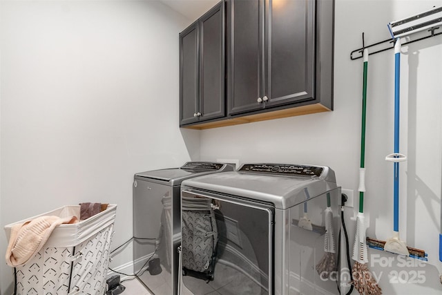 7025 Overjoyed Xing, Charlotte, NC 28215 - laundry room with cabinet space, washer and dryer, and tile patterned flooring