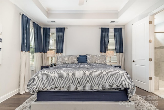7025 Overjoyed Xing, Charlotte, NC 28215 - bedroom featuring ornamental molding, wood finished floors, a tray ceiling, connected bathroom, and ceiling fan