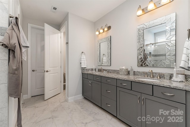 7025 Overjoyed Xing, Charlotte, NC 28215 - bathroom with marble look tile flooring, double vanity, and tiled shower