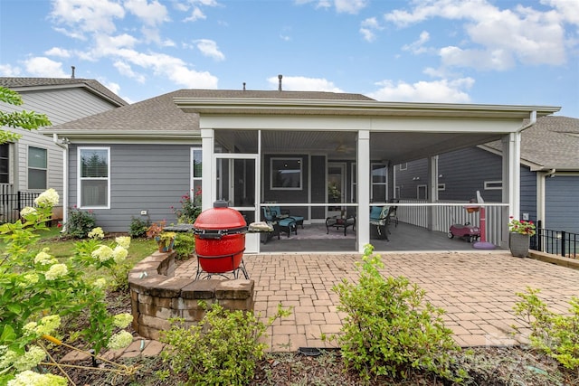 7025 Overjoyed Xing, Charlotte, NC 28215 - back of property with a sunroom, a patio area, and roof with shingles