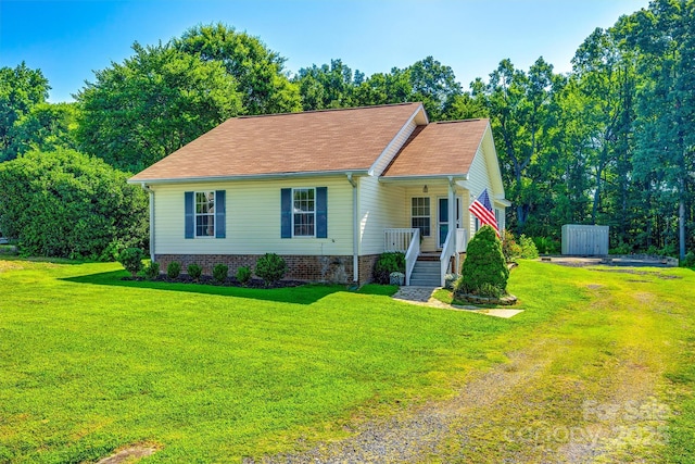 659 Primrose Ln NW, Concord, NC 28027 - view of front of home with a porch, a front yard, and roof with shingles