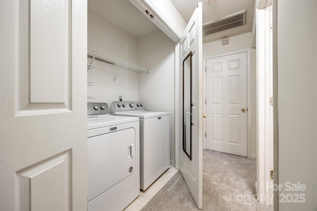 659 Primrose Ln NW, Concord, NC 28027 - laundry room with independent washer and dryer, a textured ceiling, light colored carpet, and attic access