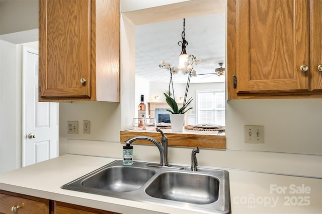 659 Primrose Ln NW, Concord, NC 28027 - kitchen with light countertops, brown cabinets, and ceiling fan
