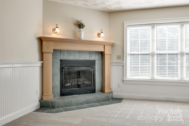 659 Primrose Ln NW, Concord, NC 28027 - detailed view of carpet floors, a wainscoted wall, and a tile fireplace