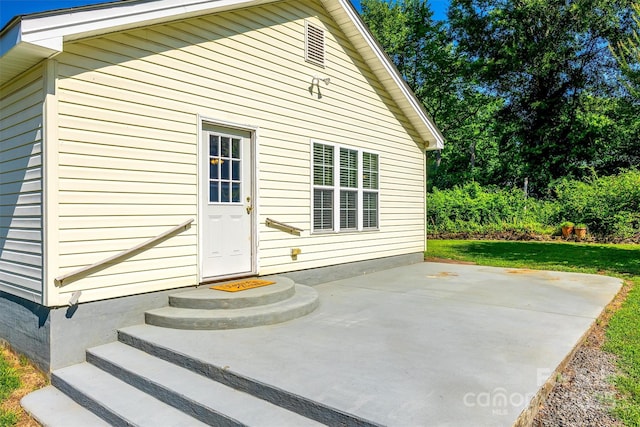 659 Primrose Ln NW, Concord, NC 28027 - rear view of house with a patio area and a lawn