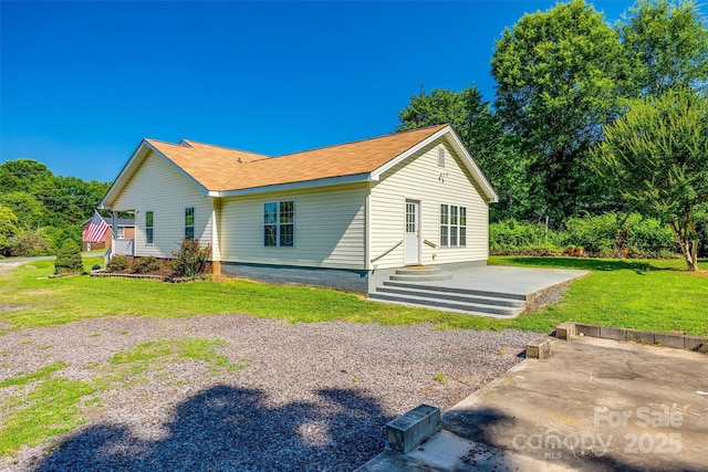 659 Primrose Ln NW, Concord, NC 28027 - rear view of house featuring a lawn