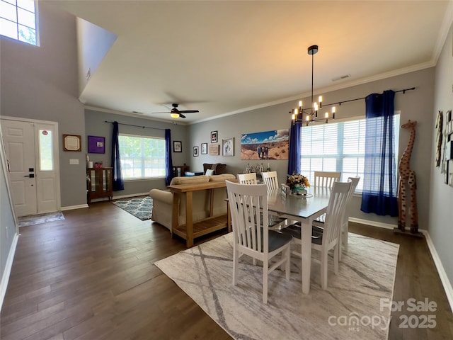 3236 Wicklow Ln, Clover, SC 29710 - dining room featuring a chandelier, wood finished floors, crown molding, and ceiling fan