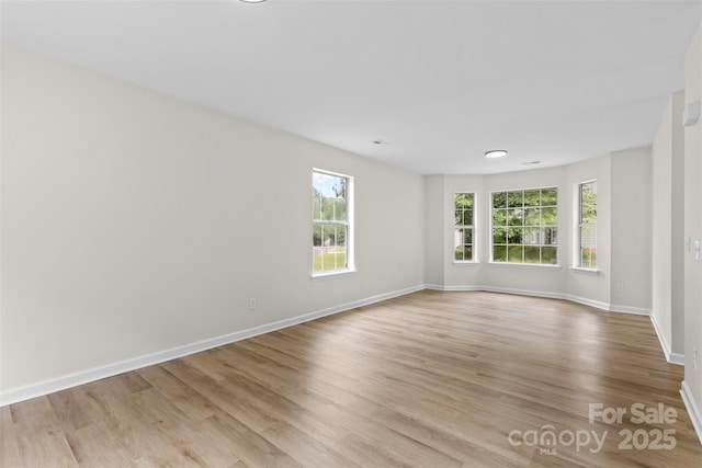 6907 Spandril Ln, Charlotte, NC 28215 - spare room with light wood-style flooring and baseboards