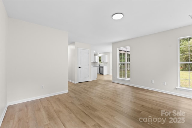6907 Spandril Ln, Charlotte, NC 28215 - unfurnished living room with light wood-style floors and healthy amount of natural light