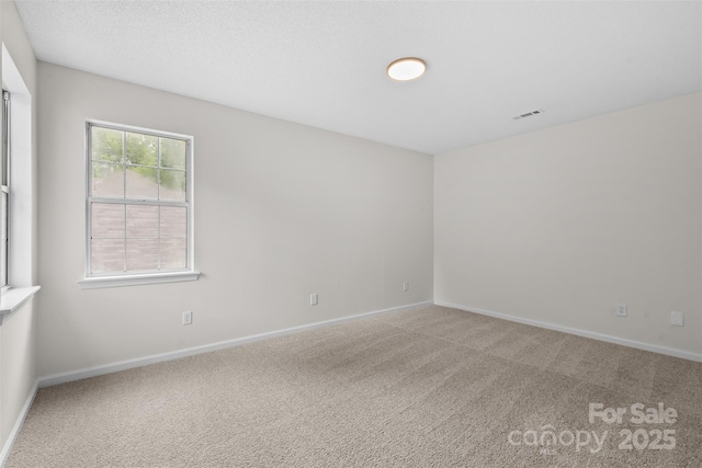 6907 Spandril Ln, Charlotte, NC 28215 - carpeted spare room featuring baseboards