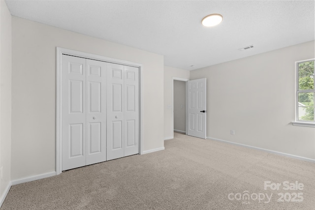 6907 Spandril Ln, Charlotte, NC 28215 - unfurnished bedroom with carpet flooring and a closet