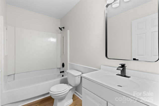 6907 Spandril Ln, Charlotte, NC 28215 - full bathroom with wood finished floors, vanity, and shower / tub combination