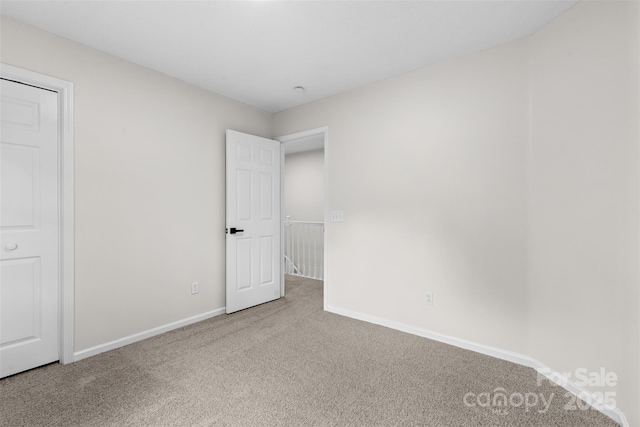 6907 Spandril Ln, Charlotte, NC 28215 - unfurnished bedroom featuring carpet flooring and baseboards