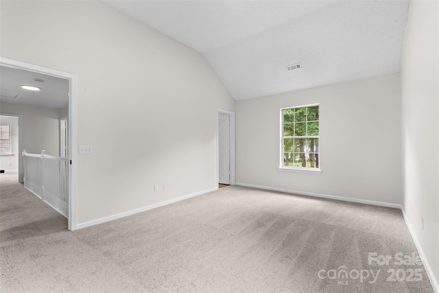 6907 Spandril Ln, Charlotte, NC 28215 - unfurnished room featuring carpet and vaulted ceiling