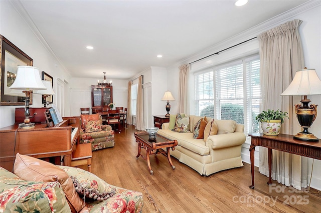 427 Lansdowne Rd, Charlotte, NC 28270 - living area with crown molding, light wood finished floors, recessed lighting, and a chandelier
