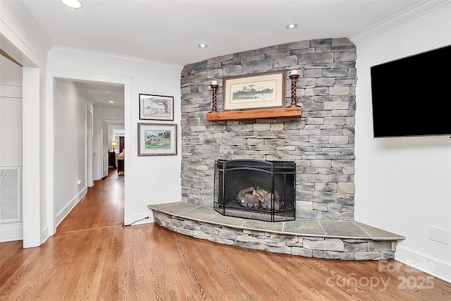 427 Lansdowne Rd, Charlotte, NC 28270 - living room featuring crown molding, wood finished floors, and a fireplace